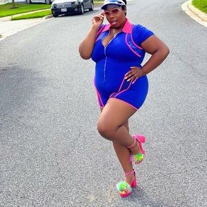 Royal romper . Mesh details in neon pink !